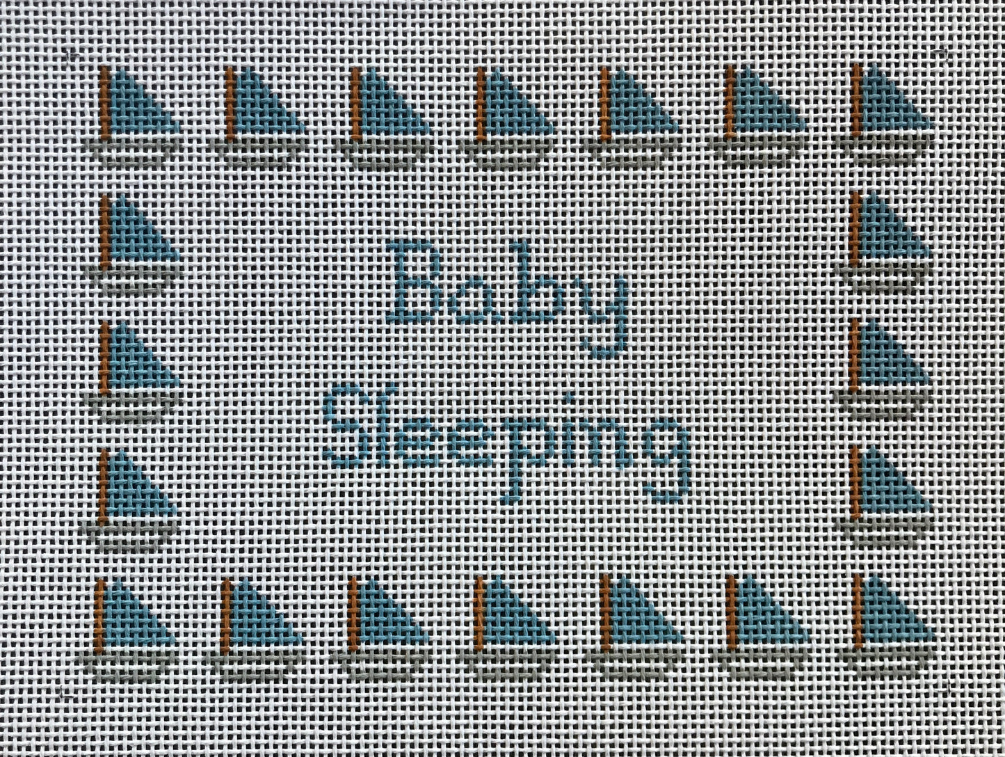 Baby Sleeping with blue sailboats