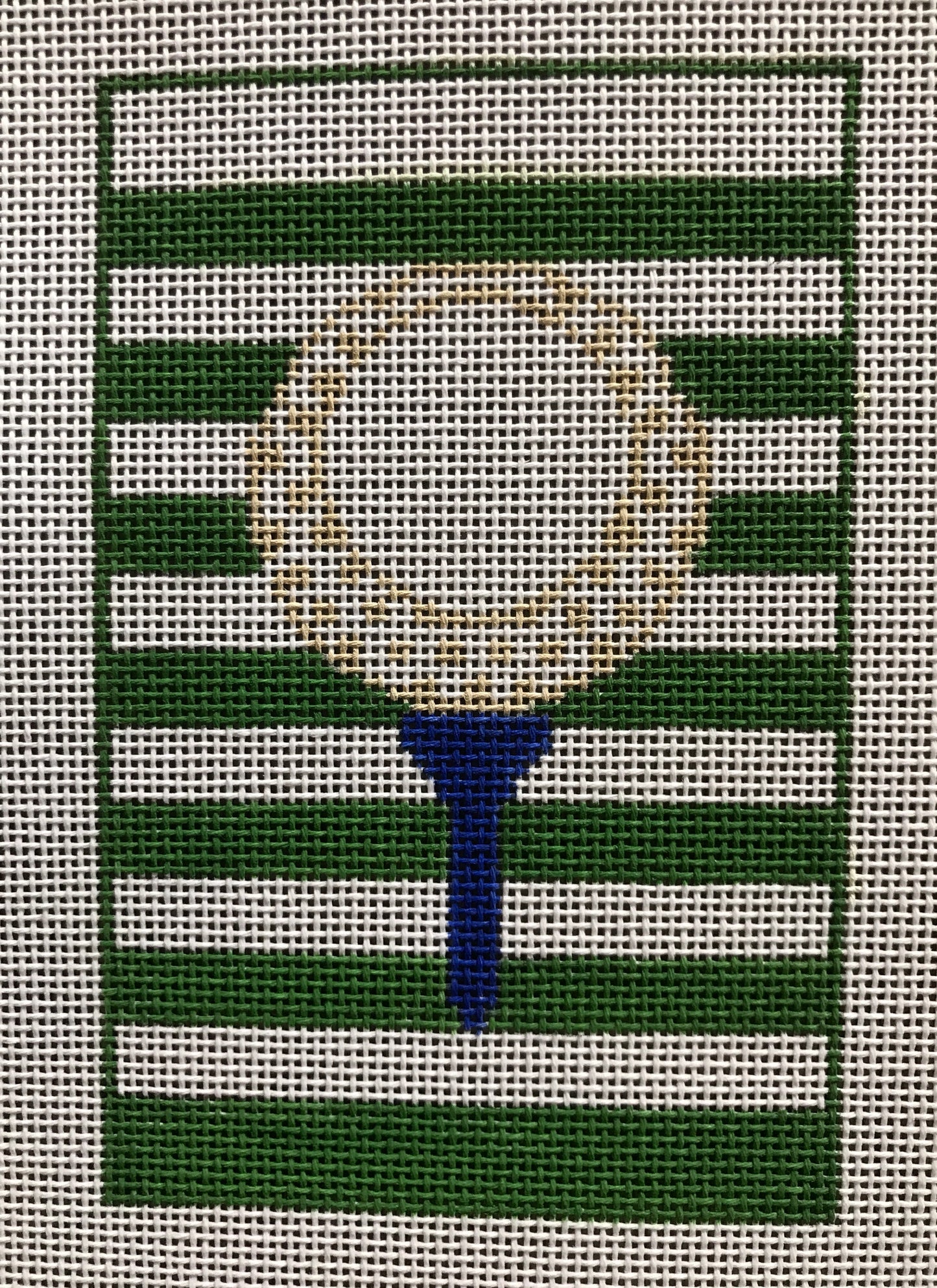 Golf Ball on Green Stripes