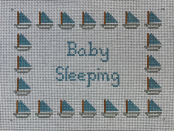 Baby Sleeping with blue sailboats
