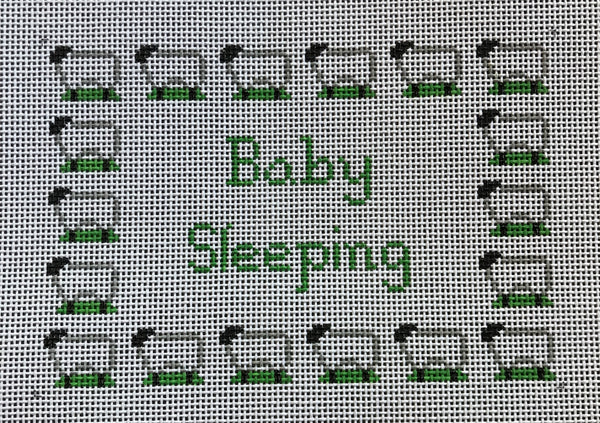 Baby Sleeping with sheep