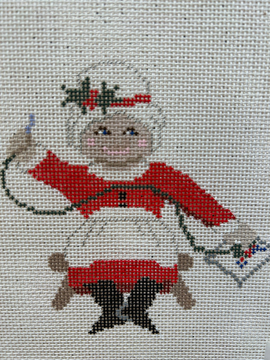 Needlepointing Mrs Claus