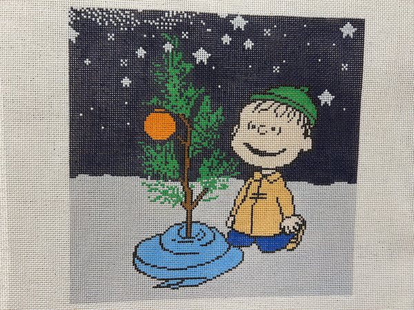 Linus Kneeling with Blanket at Tree